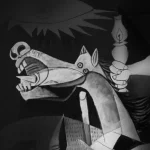 Explora la simbología del Guernica de Picasso en GraZie Magazine. Analizamos el detalle del caballo y la luz del quinqué como metáforas de la resiliencia humana y la búsqueda de la verdad en medio de la tragedia.