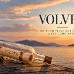Botella con el mensaje VOLVER sobre un muelle al atardecer